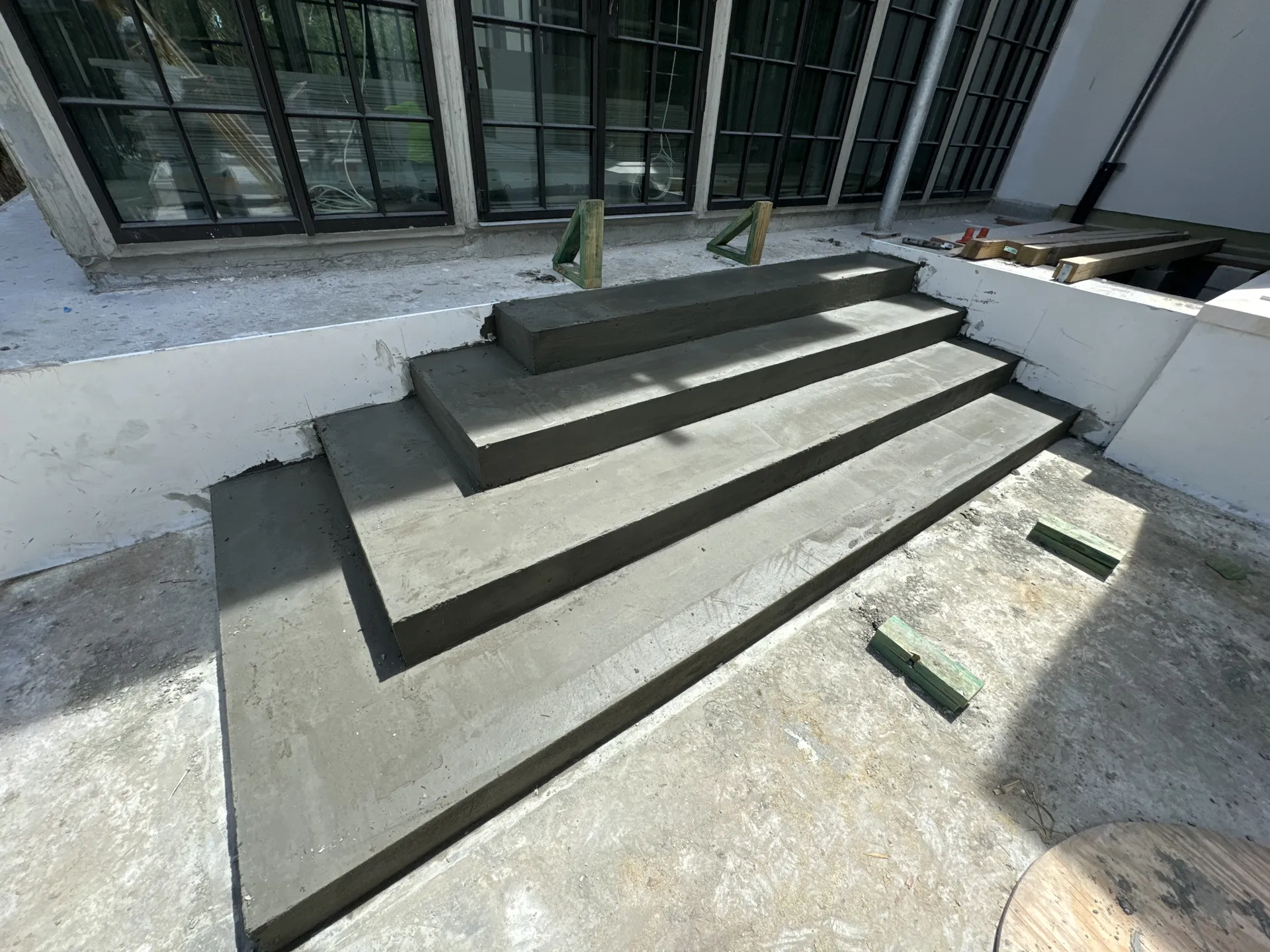 Freshly poured concrete entry stairs at a commercial building