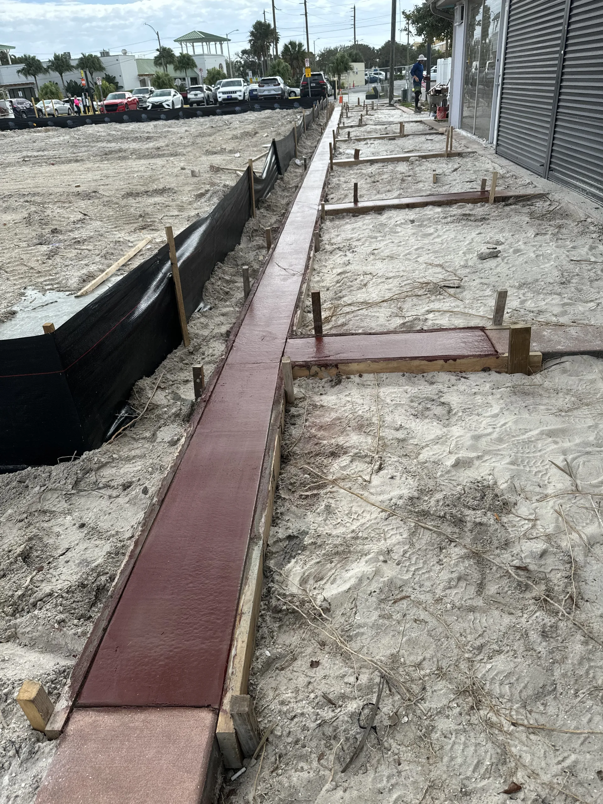 Colored concrete sidewalk poured in sections at a commercial property