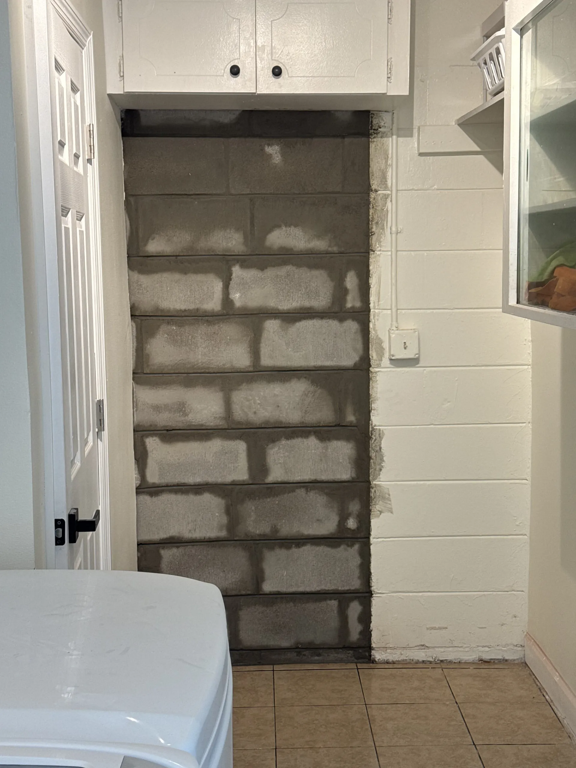 Interior CMU block wall construction filling a doorway opening