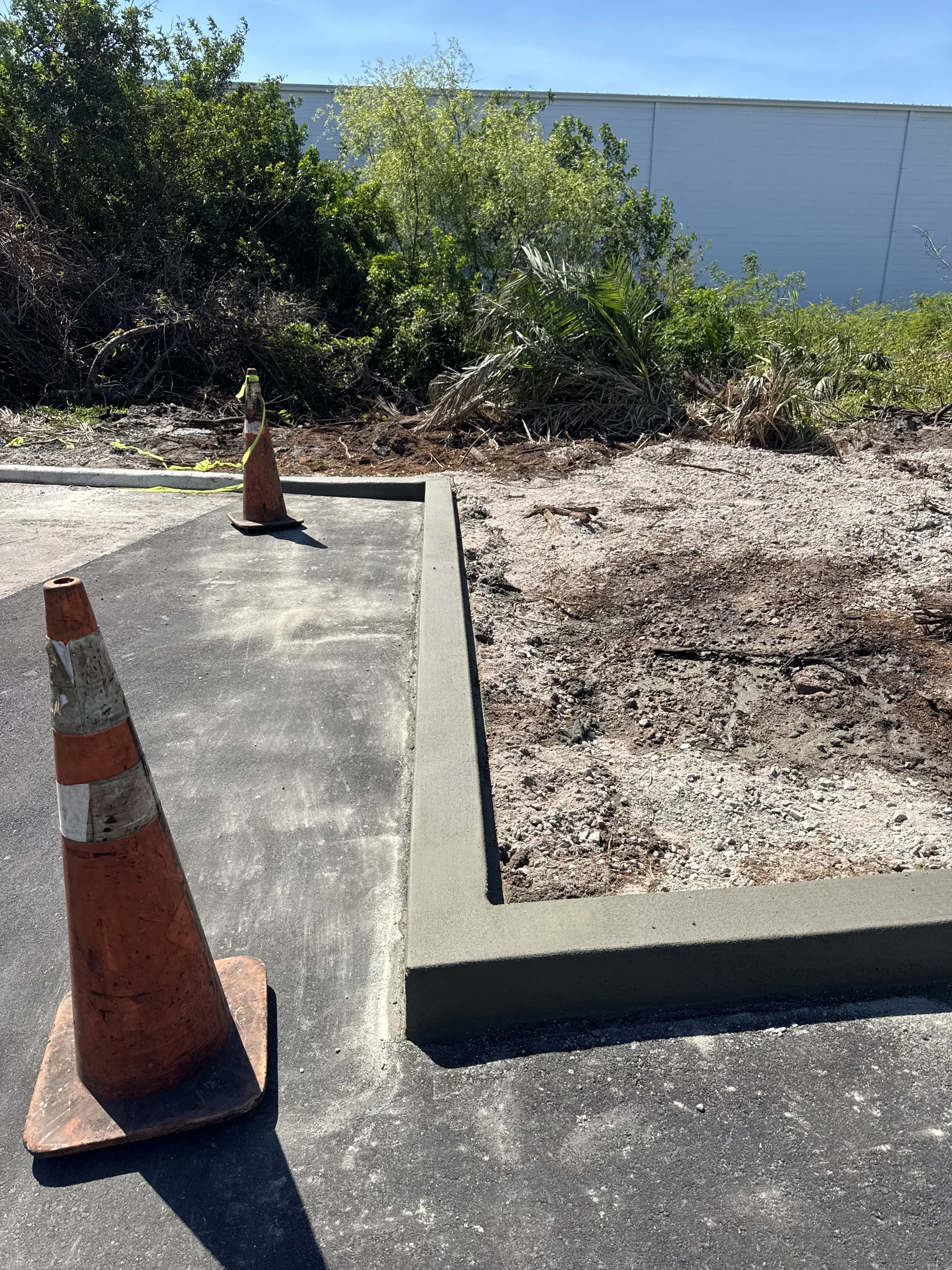 New concrete curb and edge poured at a commercial property