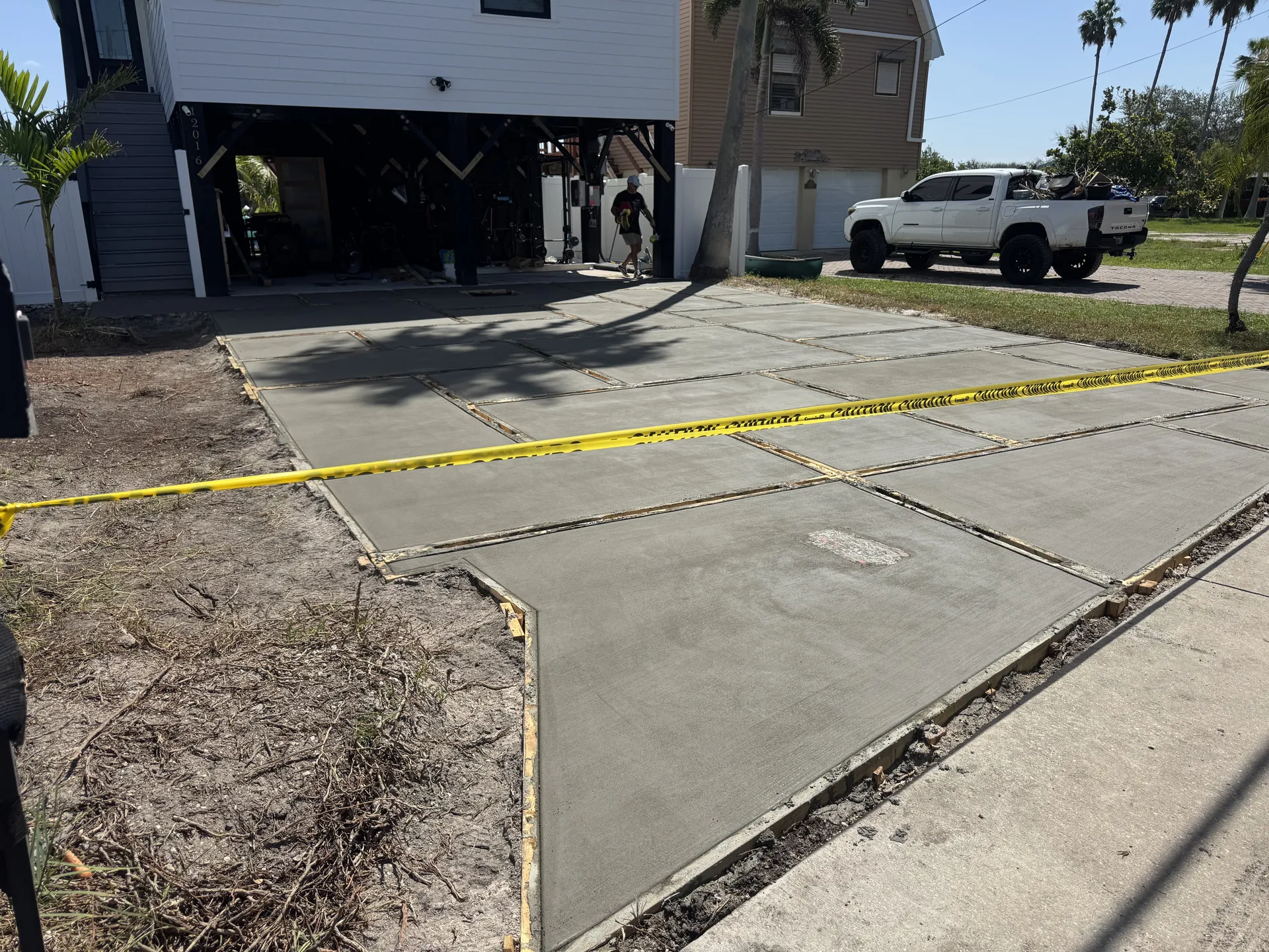 New concrete driveway poured at a raised coastal Florida home