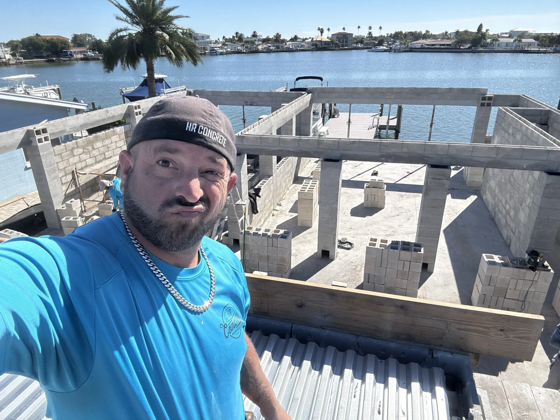 Randy Hanson, owner of HR Concrete Services, at a waterfront block wall project