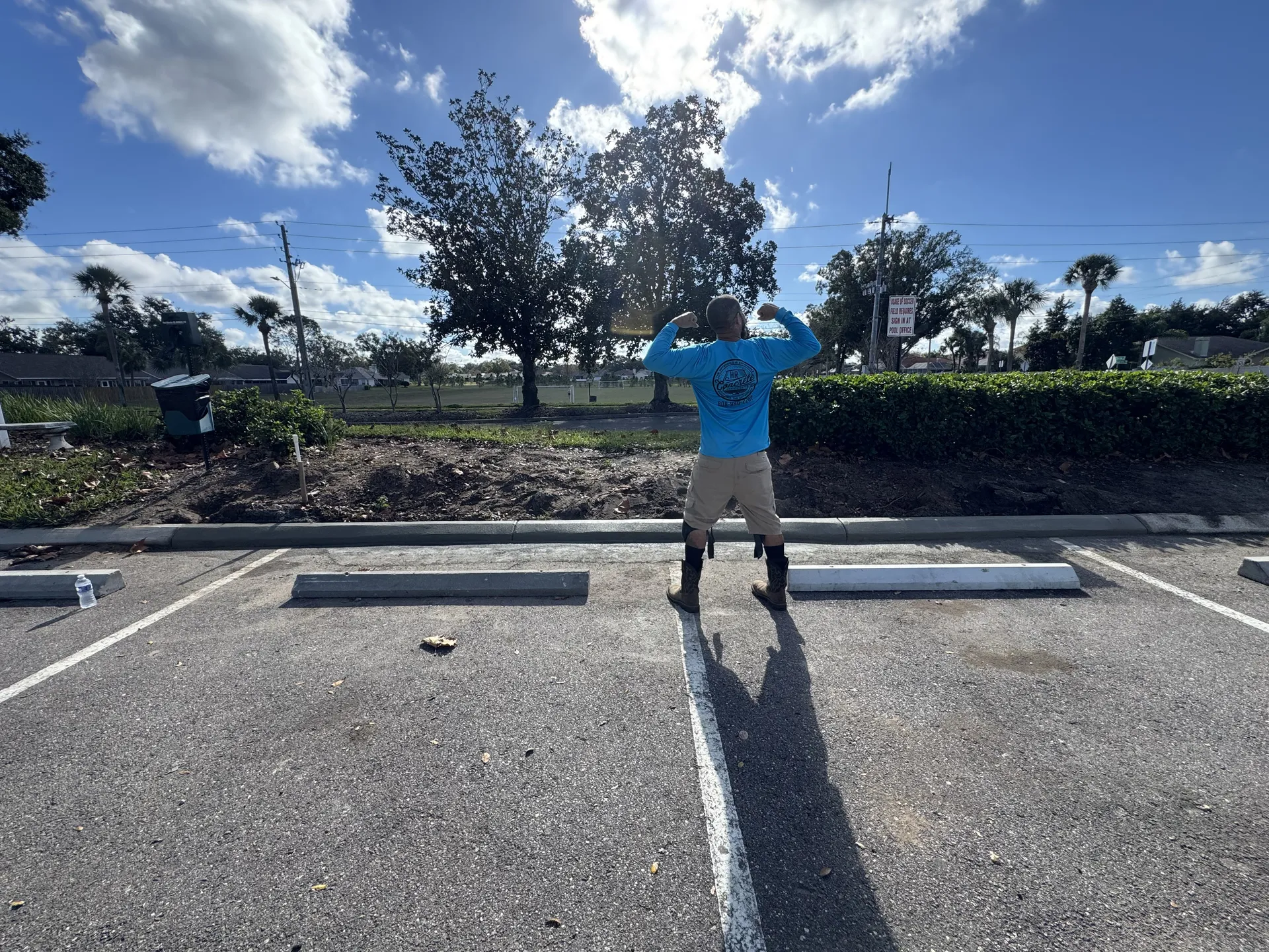 Concrete monument sign pad installation at a commercial parking lot