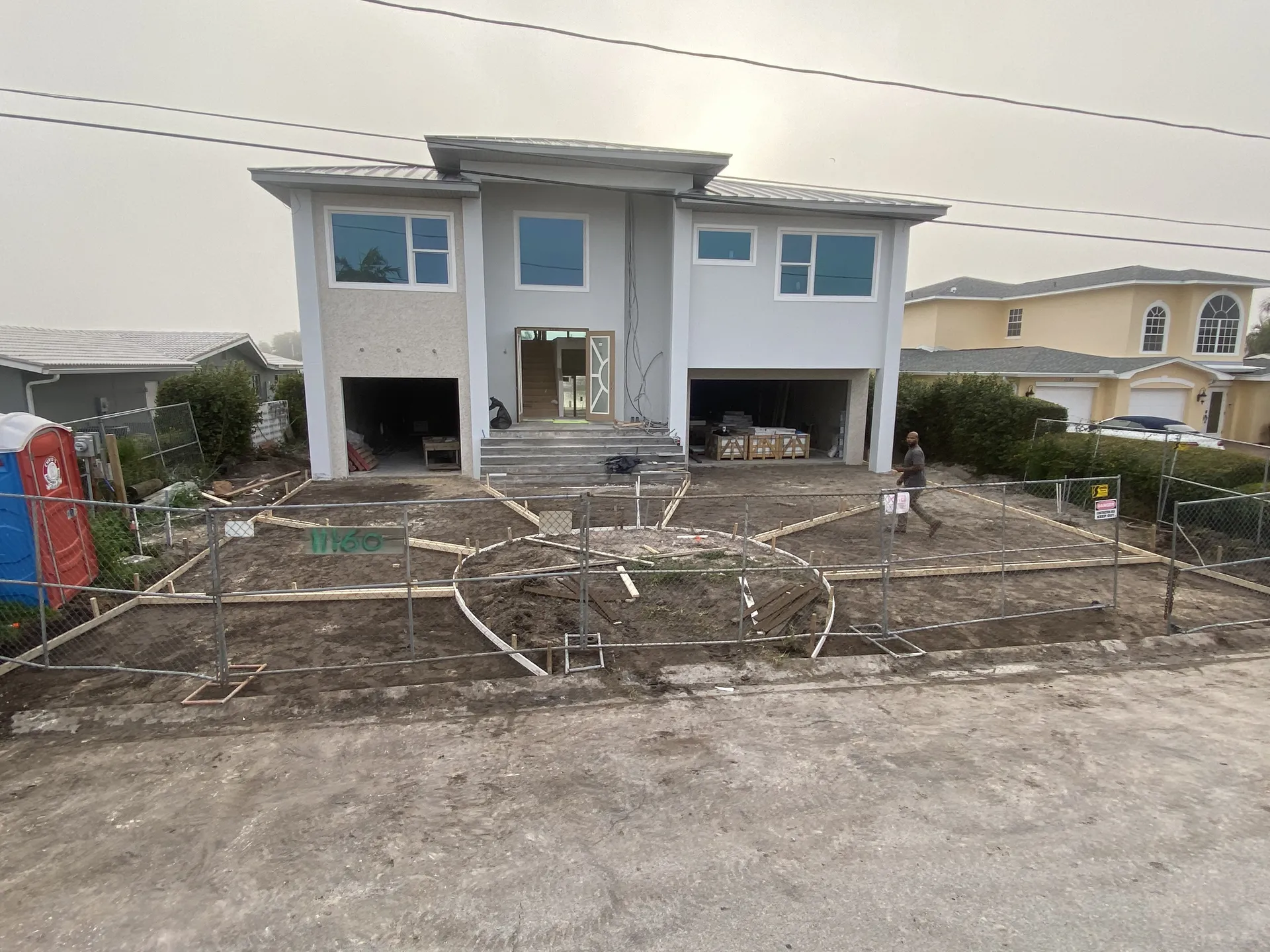 Driveway forms set for a concrete pour at a luxury new construction home