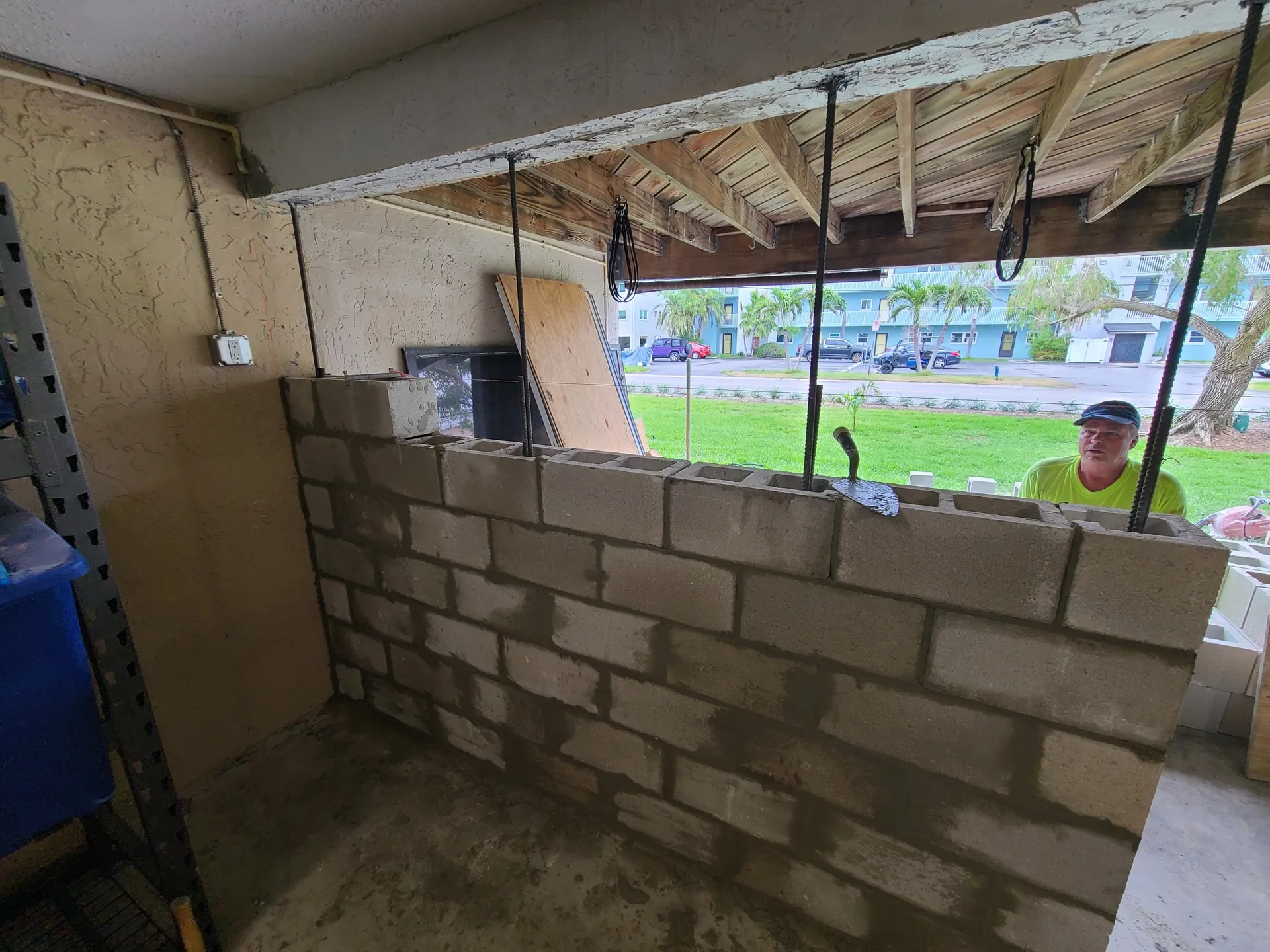 CMU block wall construction with rebar reinforcement under a building